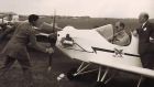 Sir John Severne swings the propeller of the Turbulent G-APNZ for HRH Prince Philip.<br />Norman Jones, founder of the Tiger Club looks on